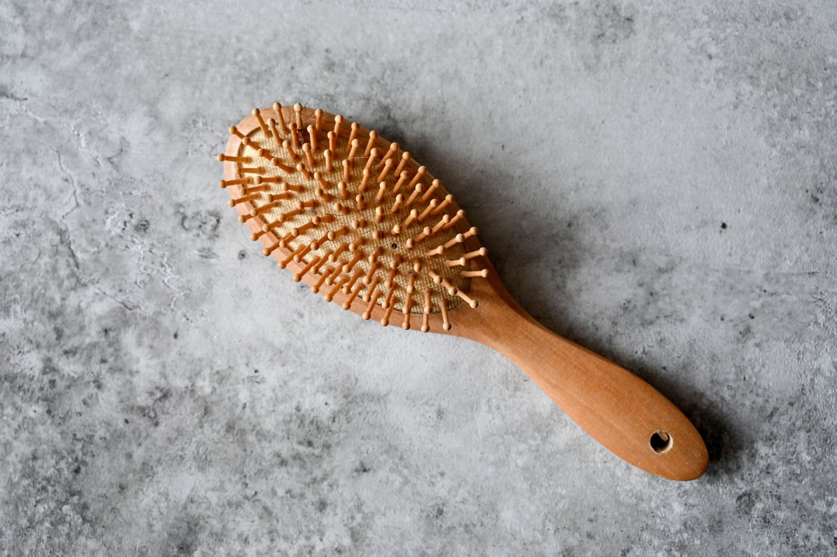 A Hairbrush on a Concrete Floor
